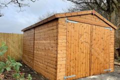14x10-Tongue-And-Groove-Jumbo-Delux-Apex-Shed-with-large-double-doors-for-vehicle-access-treated-rustic-brown22