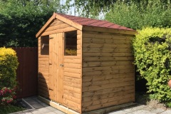 7x5-Log-Lap-Apex-Shed-with-red-shingles-single-door-and-standard-windows-treated-rustic-brown2