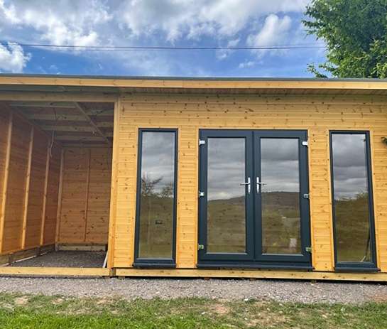 Timber Summer House with PVC Windows and Doors from Davies Timber (Wales) Ltd.